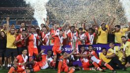 FC Goa players celebrate at the podium after winning the 2019 Hero Super Cup in Bhubaneswar