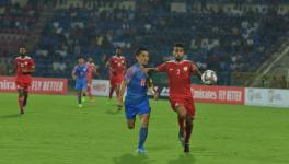 Indian football team´s Sunil Chhetri and Oman´s Mohammed al Musallami vie for the ball in their FIFA World Cup qualifying match