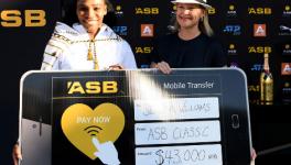 Serena Williams with her prize money cheque from Auckland Classic