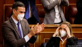 Spanish Prime Minister Pedro Sanchez and Labor Minister Yolanda Diaz react to parliament's surprise passing of a labor reform bill