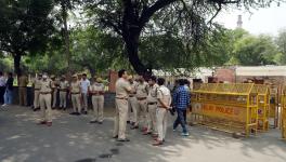 New Delhi, May 10 (ANI): Police stand outside Qutub Minar during a protest by members of right-wing organizations demanding to rename the monument to 'Vishnu Stambh', in New Delhi