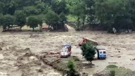 Vehicles stranded in mudslide following heavy rainfall in Kullu district, Monday, July 10, 2023. 