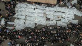 Palestinians perform funeral of victims of massacre in Rafah (Photo via Quds News Network/X)