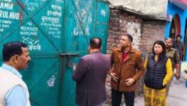Officials sealing a Madrassa in Uttarakhand.