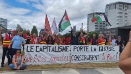 "Capitalism brings war, popular struggles build peace." Solidarity action with workers at Paris airport, June 2025. Source: BDS France-Paris/Facebook