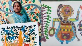 Sakun Bai showing her paintings (Photo - Satish Bhartiya, 101Reporters)