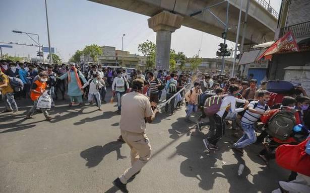 Migrant workers and police clash in Ahmedabad