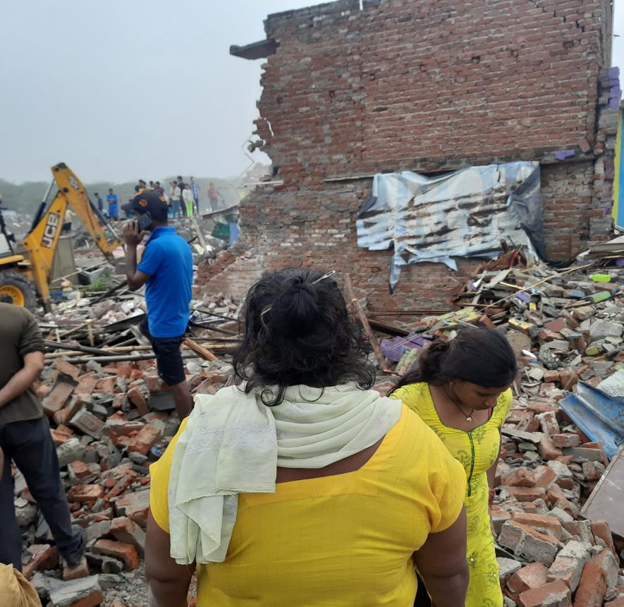 A resident as she saw her house get demolished