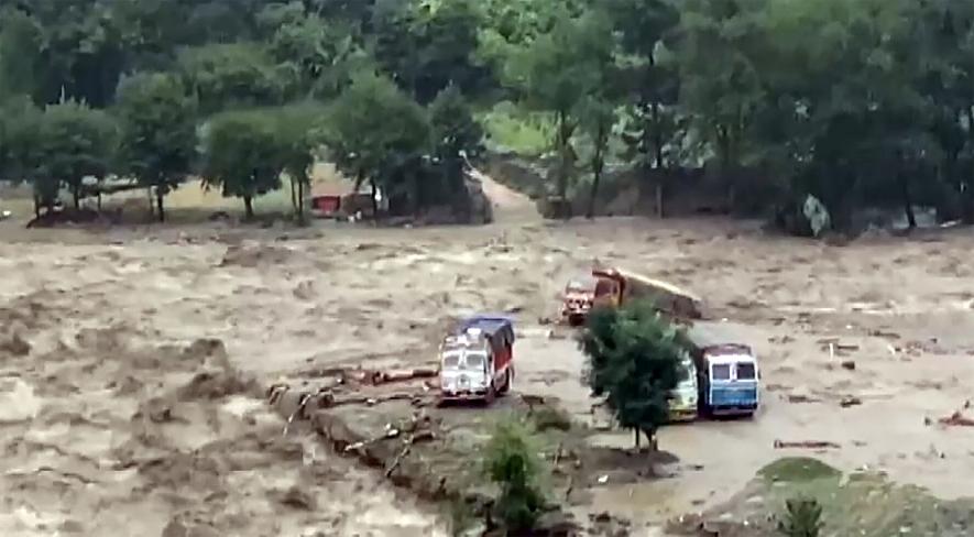 Vehicles stranded in mudslide following heavy rainfall in Kullu district, Monday, July 10, 2023. 