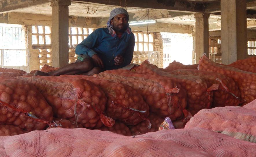 A cold storage labourer are waiting to carry potatoes bags at Sankarhati village Bankura