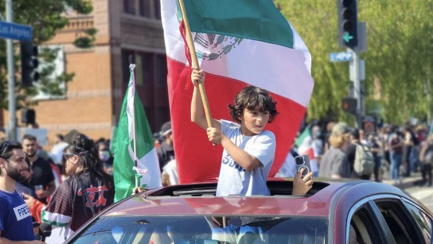 Young participant holds a Mexican flag in the anti-ICE protests in Los Angeles. Photo: PSL