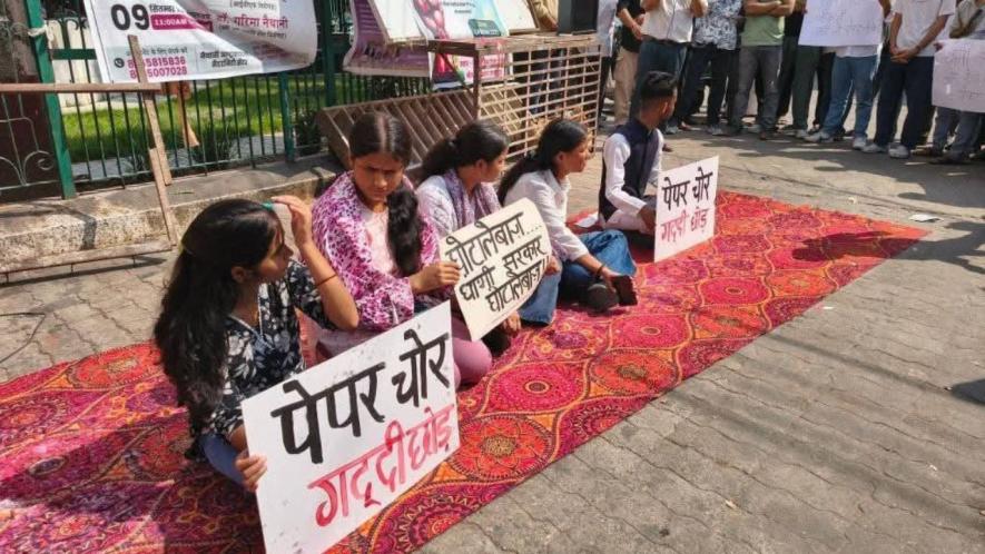  Students protesting against recruitment examination paper leak at Srinagar Garhwal on Wednesday.
