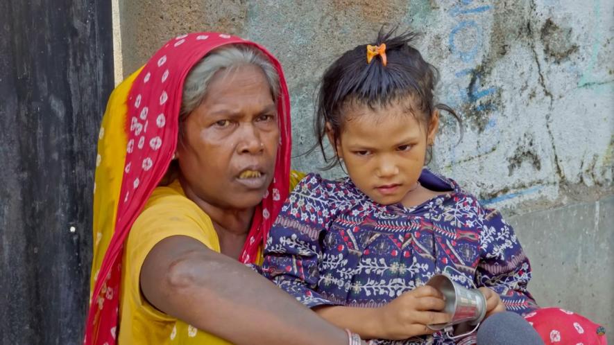 Sonali’s daughter Aafrin with her grandmother Jyostnara Bibi at their home in Paikar village, Birbhum.